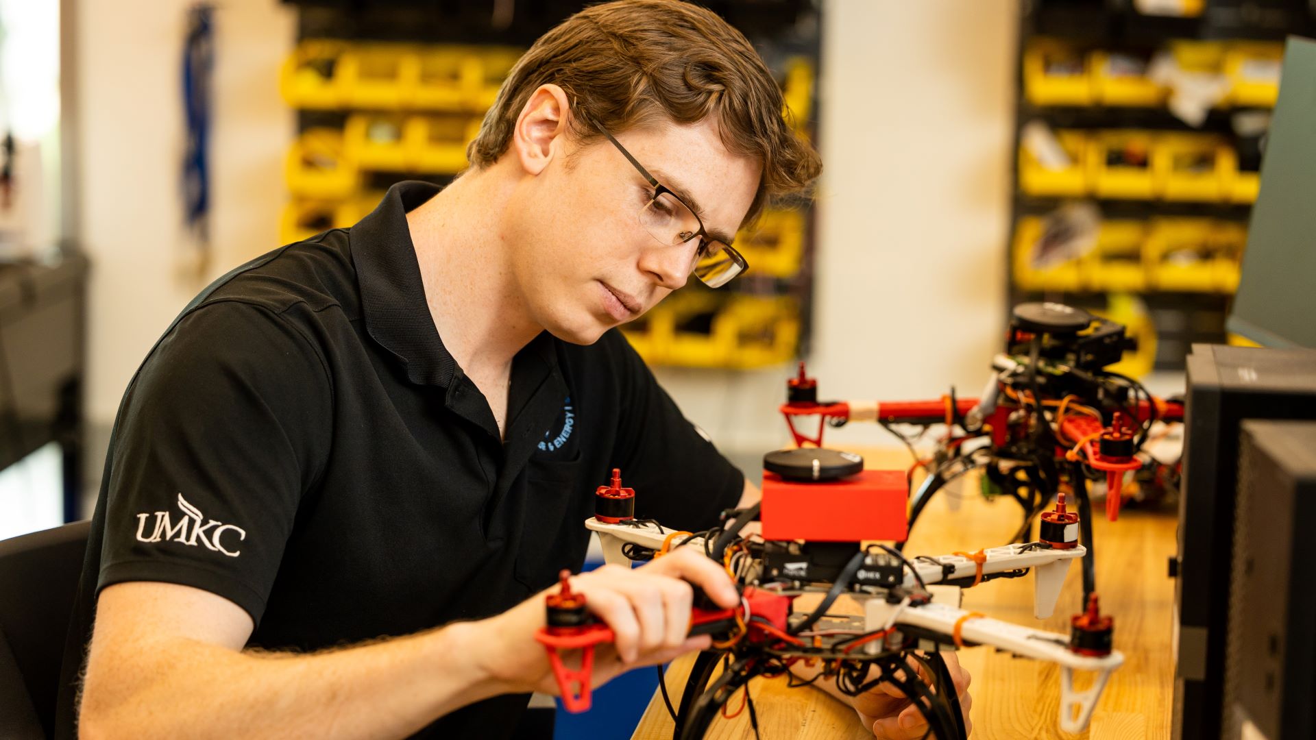 student works in drone lab